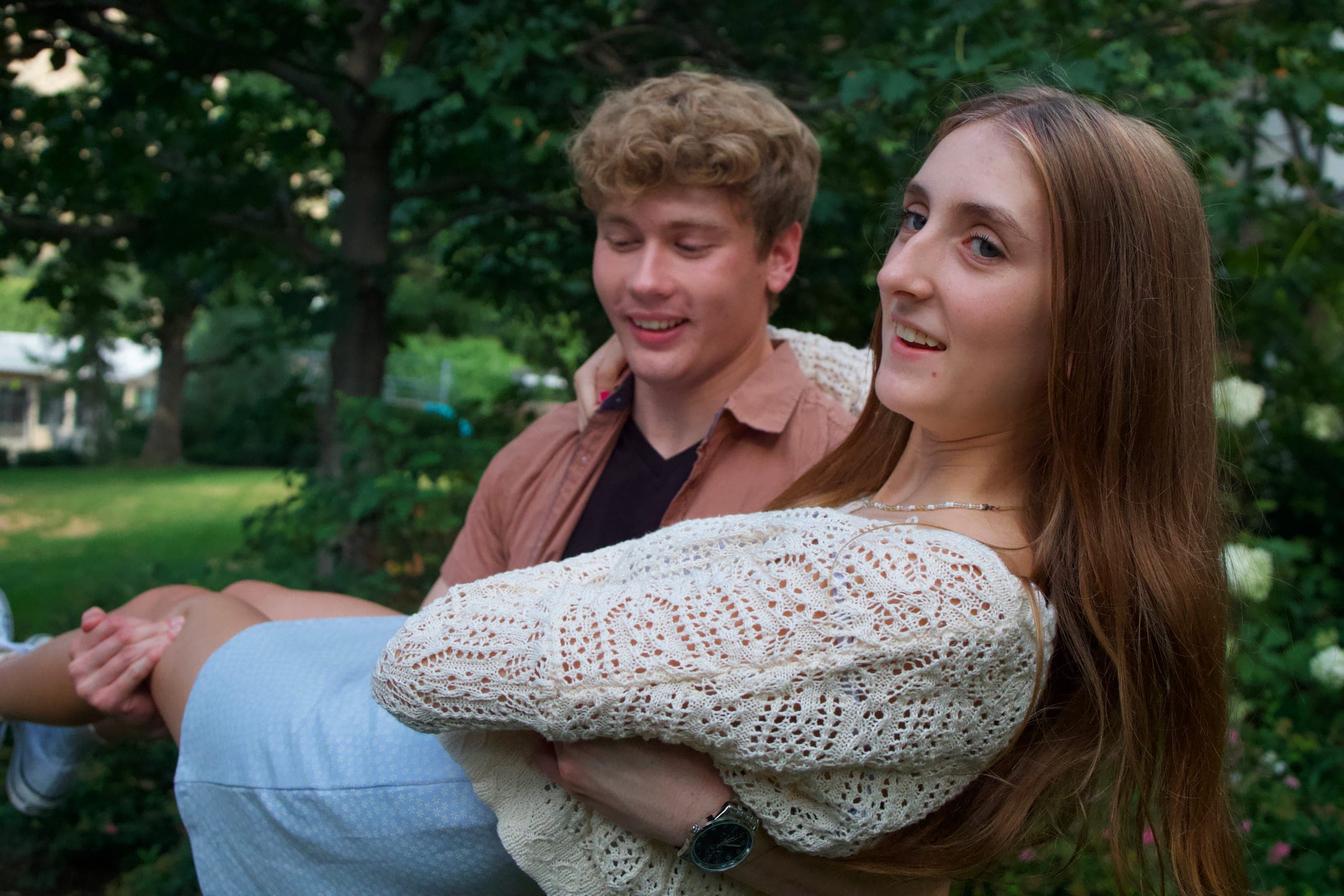 Tyler carrying Molly in his arms