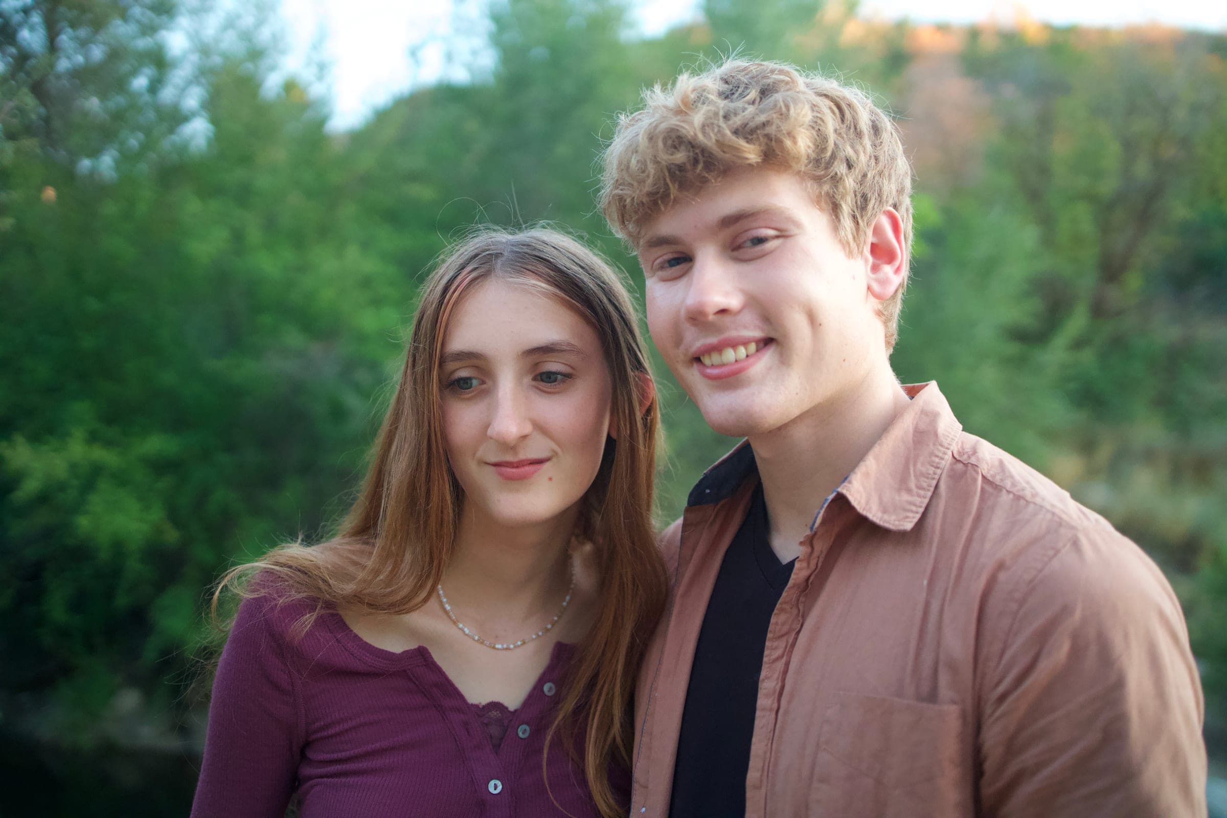 Molly and Tyler smiling by the river